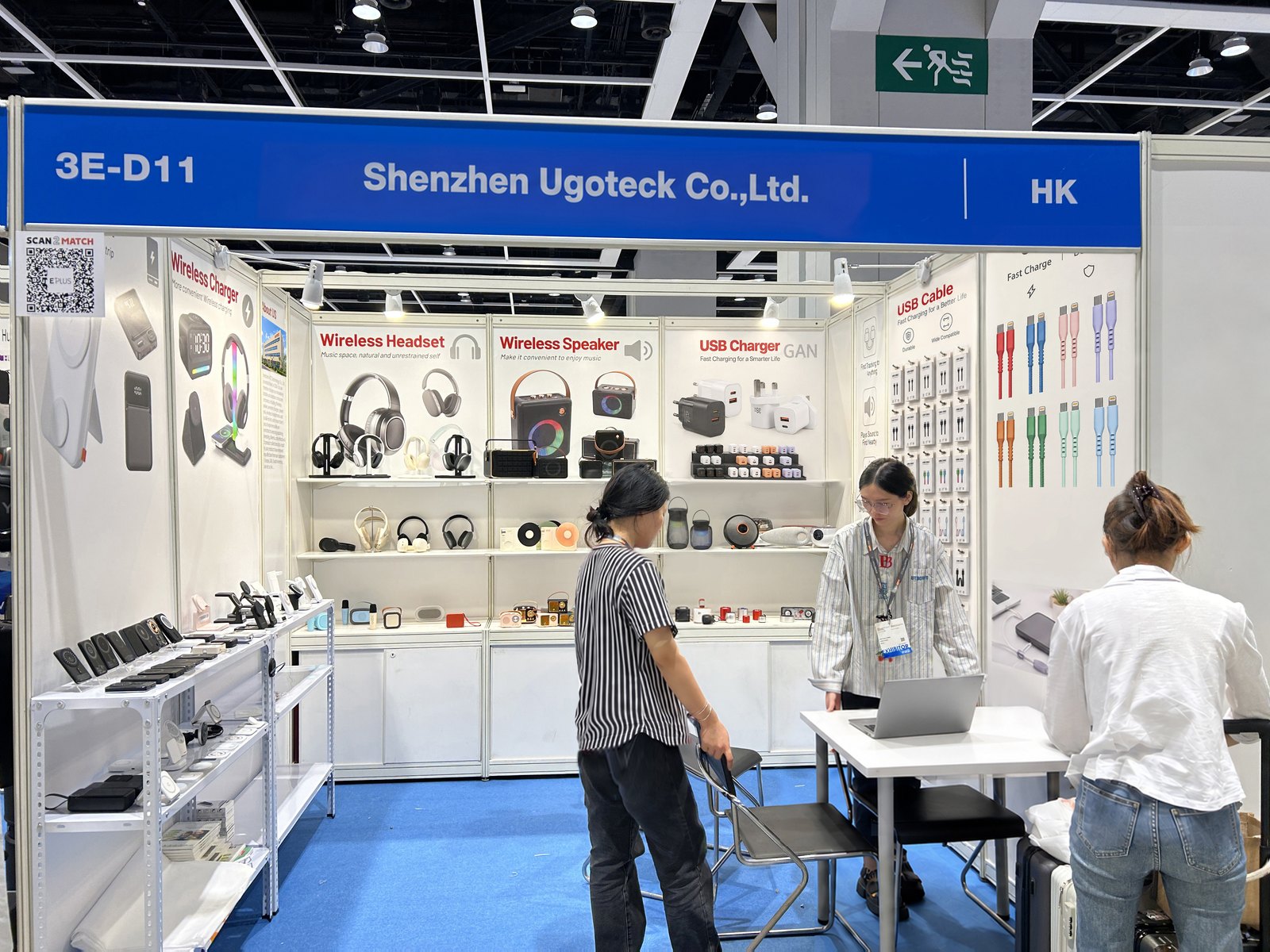 Visitors reviewing UGOTECK charging, connectivity and audio products at booth 3E-D11 during the HKTDC Hong Kong Electronics Fair 2024